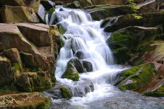 time lapse photo of waterfalls by Alexander Hipp courtesy of Unsplash.